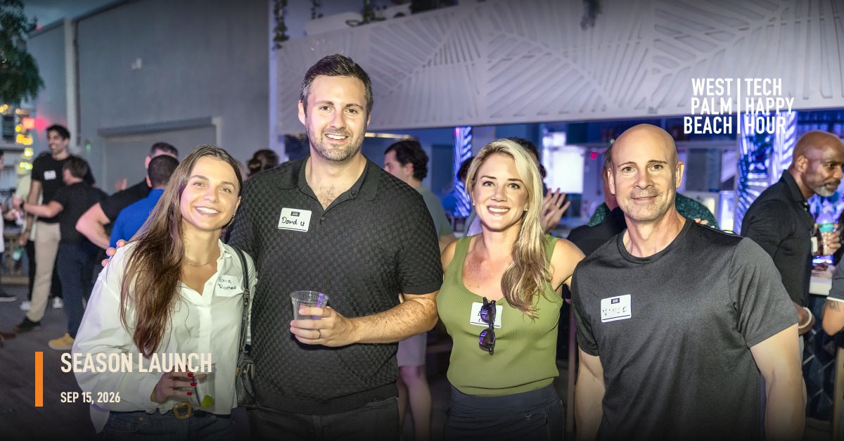Four attendees posing for a group photo